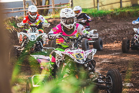 three person riding ATV's during daytime thumbnail
