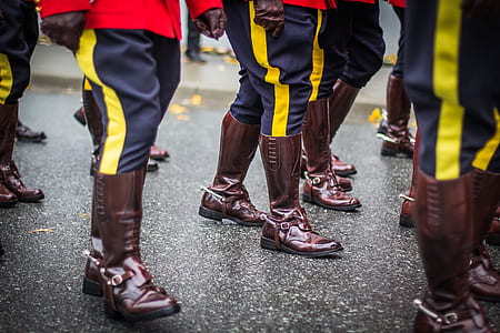 people wearing pair of brown boots thumbnail