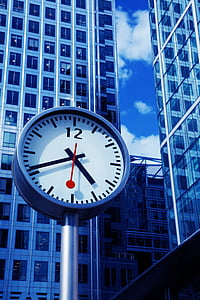 black and white street clock read at 5:46 during daytime thumbnail