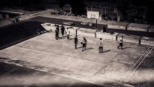 grayscale photo of people on basketball court thumbnail