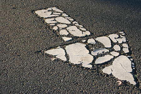 gray arrow signage on road thumbnail