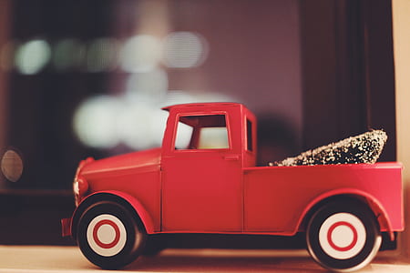 selective focus photo of red miniature truck thumbnail