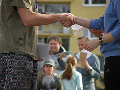 selective focus photography of two person shaking hands thumbnail