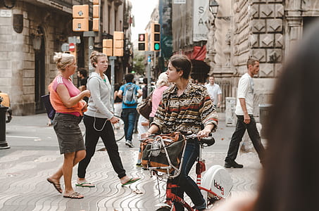 candid photography of woman riding bicycle thumbnail