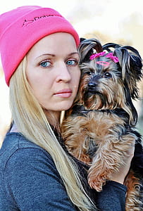 woman carrying long-coated terrier thumbnail