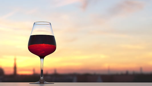 focused photography of red wine in wine glass thumbnail