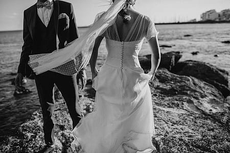 grayscale photo of couple on body of water thumbnail