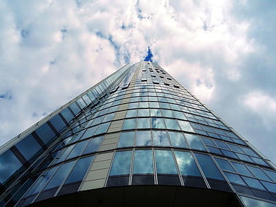 low-angle photography of building under white sky thumbnail