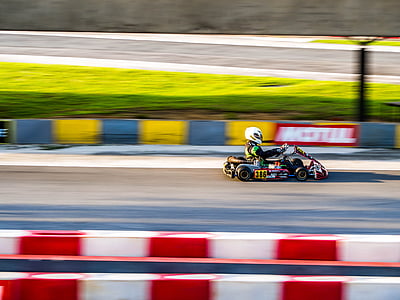 person riding on go kart at daytime thumbnail