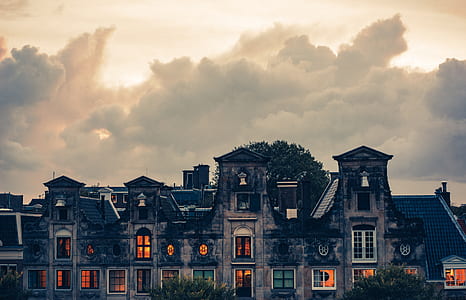 landscape photo of gray house under white clouds thumbnail