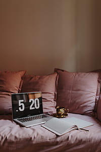 Workplace with a laptop on a pink couch thumbnail