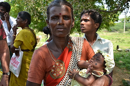 woman carrying sleeping baby thumbnail