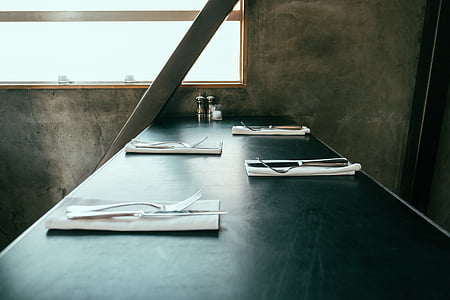 four white table napkins on table thumbnail