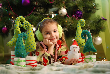 girl in front on the Christmas tree thumbnail
