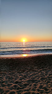 calm body of water during golden hour thumbnail