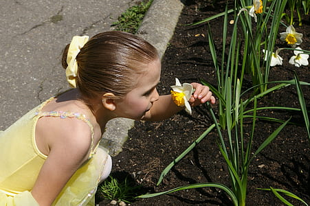 girl smelling flower thumbnail
