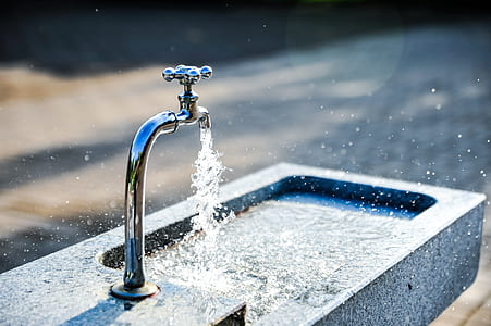 gray metal faucet on sink thumbnail