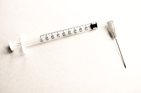 clear syringe on white surface thumbnail