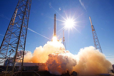 white rocket launching during daytime thumbnail