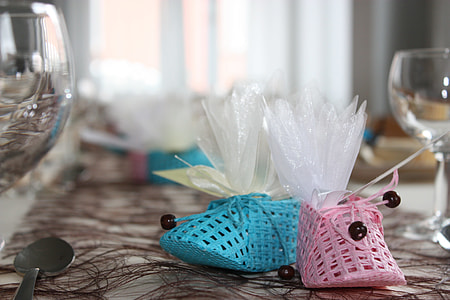 two unpaired blue and pink knitted shoes thumbnail