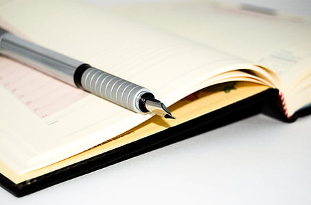 fountain pen on opened notebook thumbnail