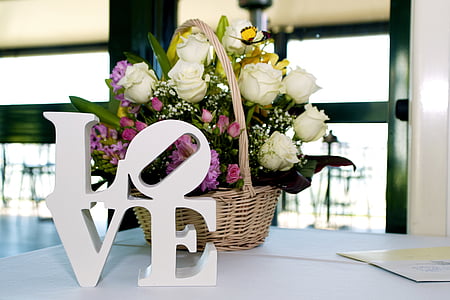 LOVE freestand letters beside brown wicker basket thumbnail