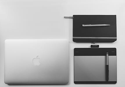 silver MacBook beside pentab thumbnail