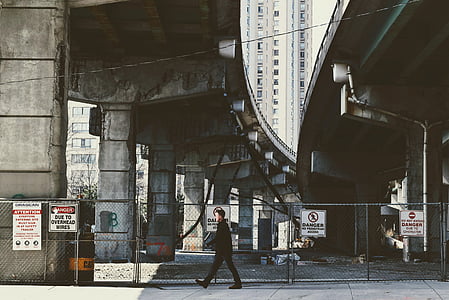 man walking on sidewalk thumbnail