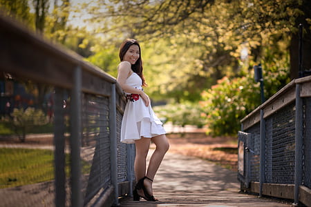 woman standing on bridge thumbnail