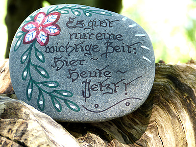 black decorative stone on brown wood thumbnail