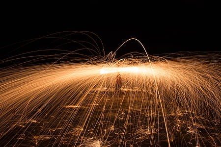 low light photography of gold sparklers thumbnail