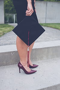 woman holding mortar board thumbnail
