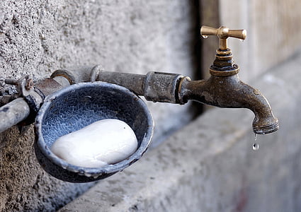 selective focus photography of soap near spigot thumbnail