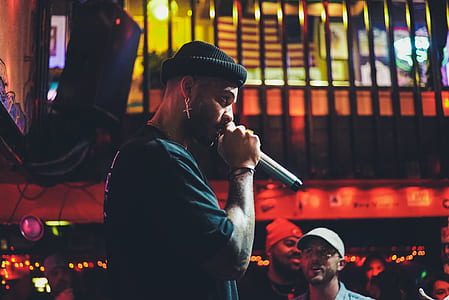 person holding black microphone thumbnail