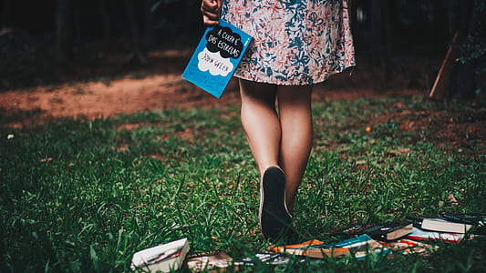 person holding Fault in our Stars novel book thumbnail