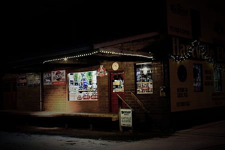 brown brick house with string lights during nighttime thumbnail