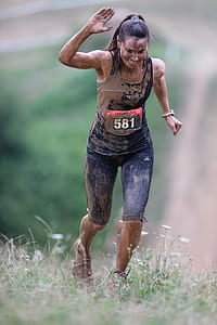 shallow focus photography of woman covered by mud thumbnail