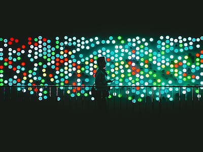 man walking near balustrade with boke lights thumbnail