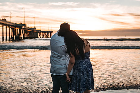 man standing beside woman also standing outside thumbnail