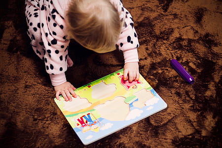toddler playing with puzzle thumbnail