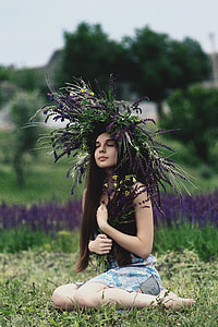 woman wearing black tank top near purple petaled flower thumbnail