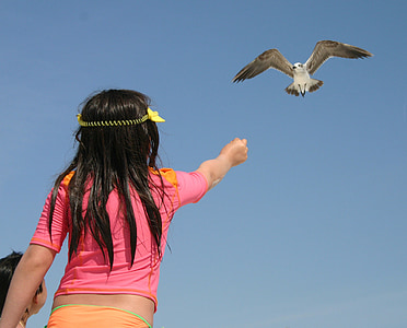 girl feeding bird thumbnail