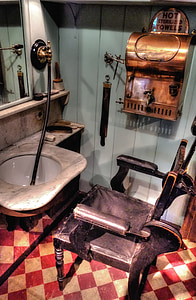 black wooden chair beside sink thumbnail