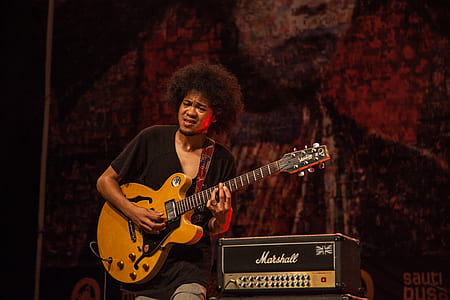 man playing jazz guitar on stage thumbnail