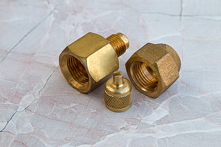 three gold bolt fasteners on tile thumbnail