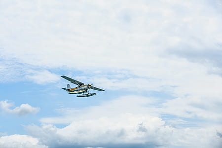 white monoplane flying on the sky thumbnail