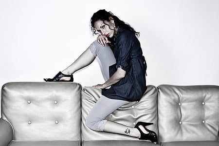 woman on gray leather couch thumbnail