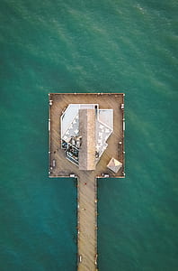 aerial view of cottage over body of water thumbnail