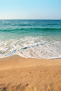 sea waves in seashore under blue sky thumbnail