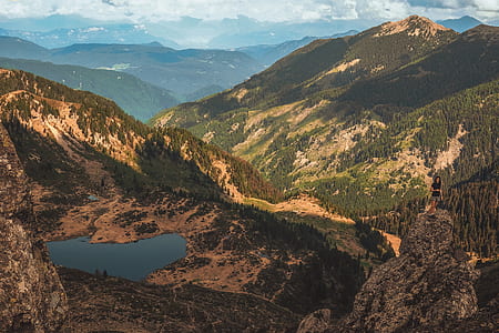 bird's-eye view of mountain under cloudy sky thumbnail